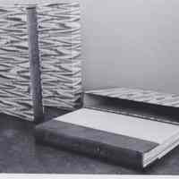 Photo of two books with their book cases
