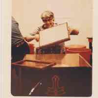 Photo of Stella Patri holding up a frame