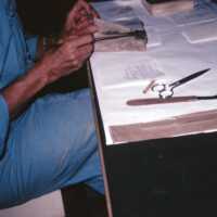 Scan of a slide of a conservator at work