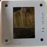 Patri holding a text block showing the spine