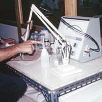 Scan of a slide of a conservator at work