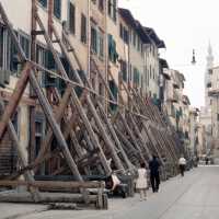 Scanned photo showing houses bring braced
