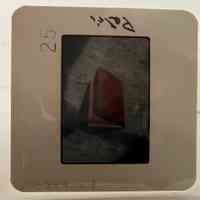 Slide of a book with a red cover