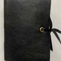 Handmade miniature book ; black leather cover, exposed gold spine sewing, black ribbon ties