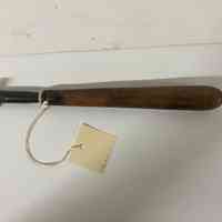 Hand finishing tool with a floral corner