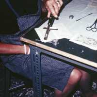 Scan of a slide showing a conservator at work