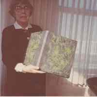 Photo of Stella Patri showing a book