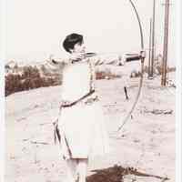 Photo of Patri practicing archery