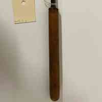 Hand tool with a curl to the right