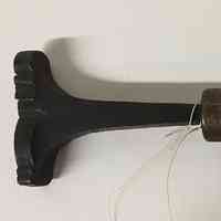 Hand tool with curling leaves