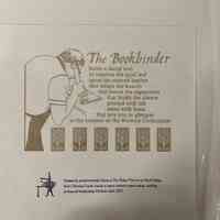 The Bookbinder holds a metal tool ...