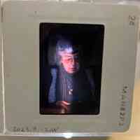 Slide of Patri holding a book