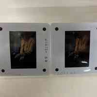 Patri pointing toward a book on a bench