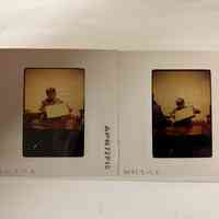 Photo of Patri holding a paper frame