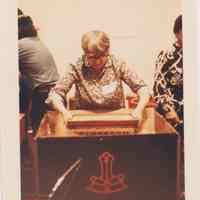 Photo of Stella Patri lifting a frame