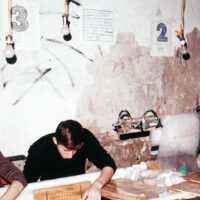 Scan of a slide showing a conservator at work