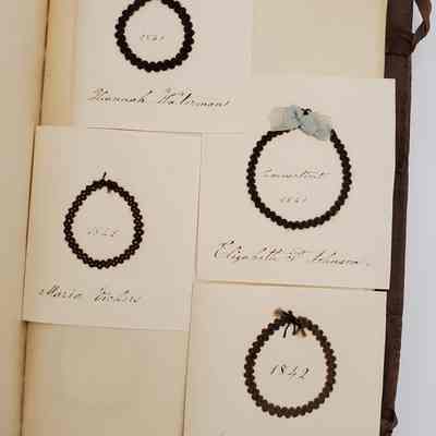 Amy Hall Williams Hair Album 1834-1844: Hair Samples from: Hannah Waterman 1841; Elizabeth P. Johnson 1841, Connecticut, with blue ribbon; Maria Vickers 1842; Mary G. Lingles 1842