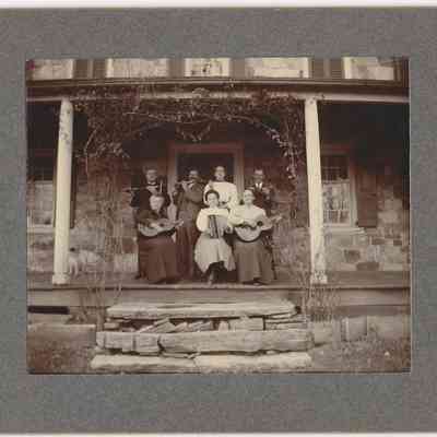 Edwin and Lydia Gilbert, Abbie Gilbert, Percy Wollaston, Elwood and Amy Ida Glisson, Ada Pearl: front of photograph with frame - Top row (left to right): Elwood Glisson, Edward Gilbert[?], Abigail W. Gilbert Wollaston[?], Percy Wollaston[?]
Bottom row (left to right): Amy Ida Glisson, Ada E. Pearl Gilbert[?], Lydia J. Cox Gilbert
(Based on cross-reference with 2023.006.044 "Gilbert and Glisson Family")