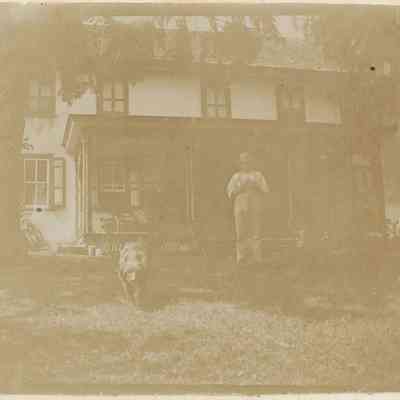 Local Families Photograph Collection/Elwood Glisson and home (with dog)