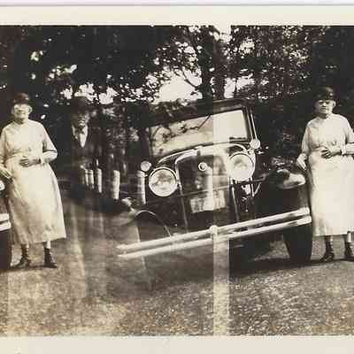 Local Families Photograph Collection/Elwood and Amy Ida Glisson (double exposure w car)