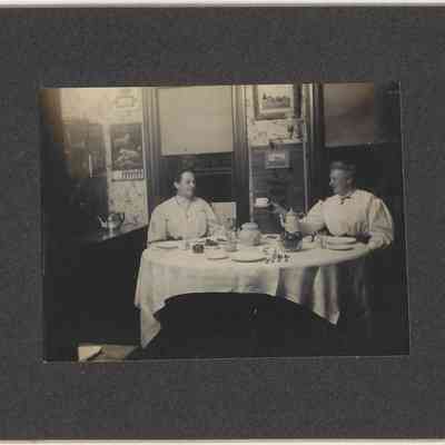 DeEtta and Mabel Hall (having tea): front of photograph with frame/mount
