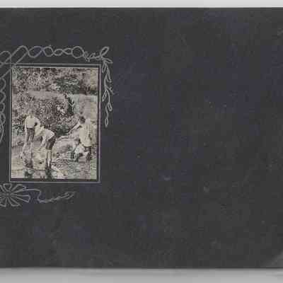 DeEtta Hall: Front cover of photograph album featuring a small photograph, individuals unidentified