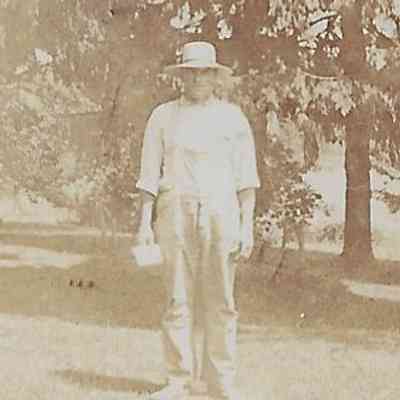 Local Families Photograph Collection/Elwood Glisson in overalls in front of home