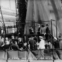 Sponsor Mrs. Wallace prepares to christen battleship Iowa. Note Mrs Roosevelt in the lower left, (wearing a hat). F1111C164