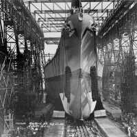 USS Iowa sliding down the slipway into the East River after being christened at the Brooklyn Navy Yard. F1111C158