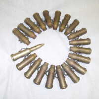 A Belt of 19 Expended CIWS Cartridges and an All-Up Dummy Round