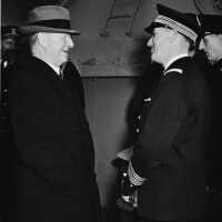 SECNAV Frank Knox with Capt Marcel Decamond, CO of the French battleship RICHELIEU refitting in New York. NH 70494