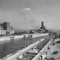 Tug boats push IOWA further into her dry dock. Note the facility is still under construction. October 20, 1942 - 80-G-13558