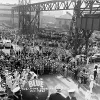 USS Iowa shipyard workers and guests face the launch stand. Note a Navy band performing in the lower left. F1111C161