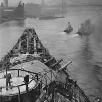 IOWA being towed towards the Brooklyn Bridge and her dry dock. October 20, 1942 - 80-G-13569