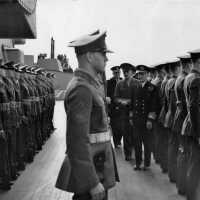 RADM Sir Walwyn, Royal Navy - Governor General of Newfoundland inspects IOWA’s Marines. October 15, 1943.