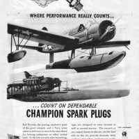 An August 1944 Champion Spark Plugs advertisement featuring an OS2U Vought Kingfisher.