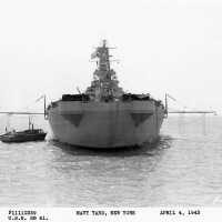 Stern view of USS Iowa anchored off New York with boat booms rigged. April 4, 1943 - F1111C359.