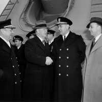 L to R - RADM E. J. Marquart, SECNAV Frank Knox, IOWA CO Capt John McCrea & Iowa Gov Burton B. Hickenlooper. - NH 70495