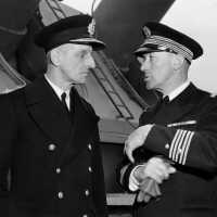 Left - Unkown Royal Navy Officer with Capt Marcel Decamond, CO of the French battleship RICHELIEU. USN photo.
