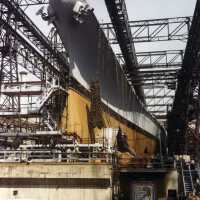 USS Iowa on the slipway ready to be launched. Note drag chains hanging from the bow. Rare color photo 80-G-K-13507