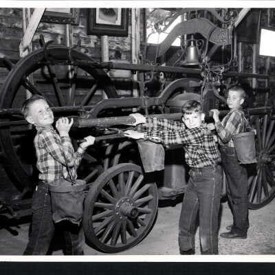 Three Boys Pose With a Vehicle at the Pony Express Museum, CA.