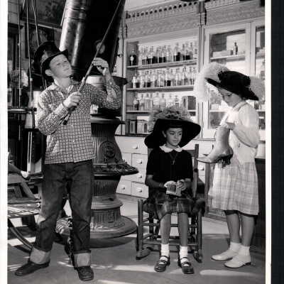 Three Children Pose With Objects at the Pony Express Museum, CA