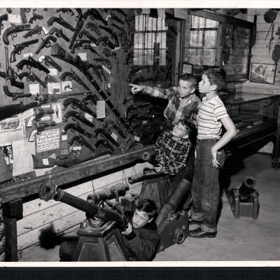 Four Boys Looking at the "Gun Room"