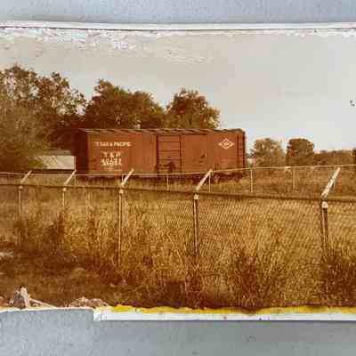 Photo of Texas & Pacific Train Car in Field