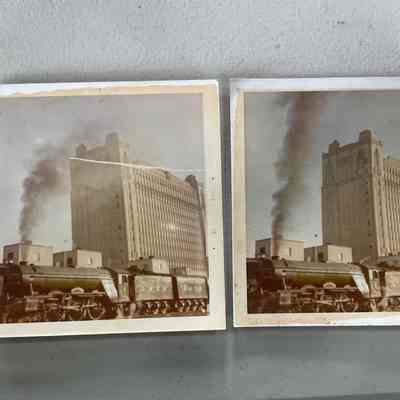 Photo of Train near large building by W C Roy