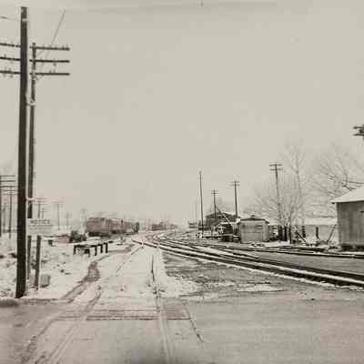 Photo of Train Tracks and Rail Cars with Snow