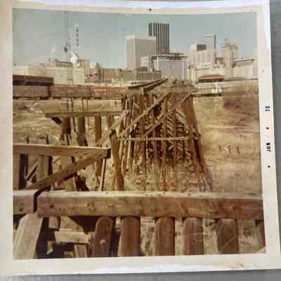 Photo of Train in Large City and old Tressel by W C Roy