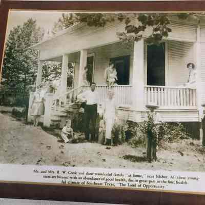 Photo of Mr and Mrs R.W. Cook and family at home near Silsbee