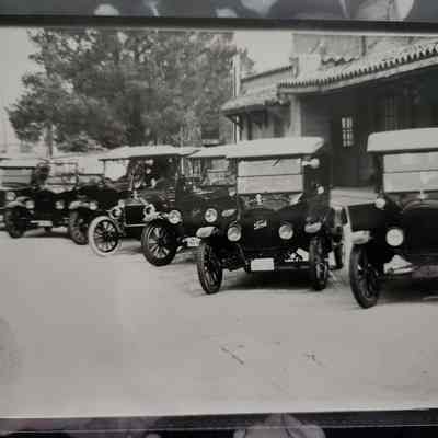 Photo of Antique Cars in Front of Ice House Museum