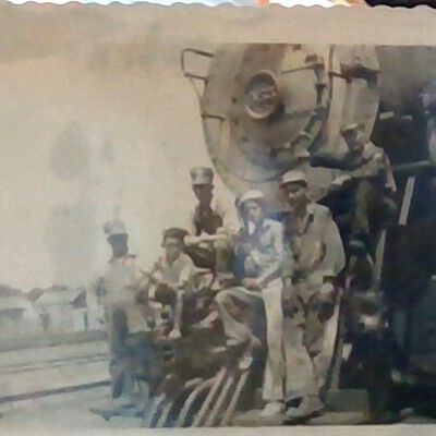 Photo of Train Workers on Front of Engine 953